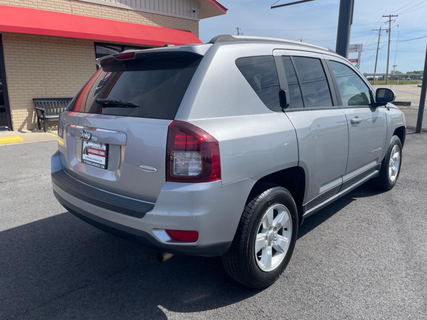 2016 Silver Jeep Compass (1C4NJCEA4GD) with an 4-Cyl, 2.0 Liter engine, Automatic, CVT transmission, located at 8008 Warden Rd, Sherwood, AR, 72120, (501) 801-6100, 34.830078, -92.186684 - Photo#7